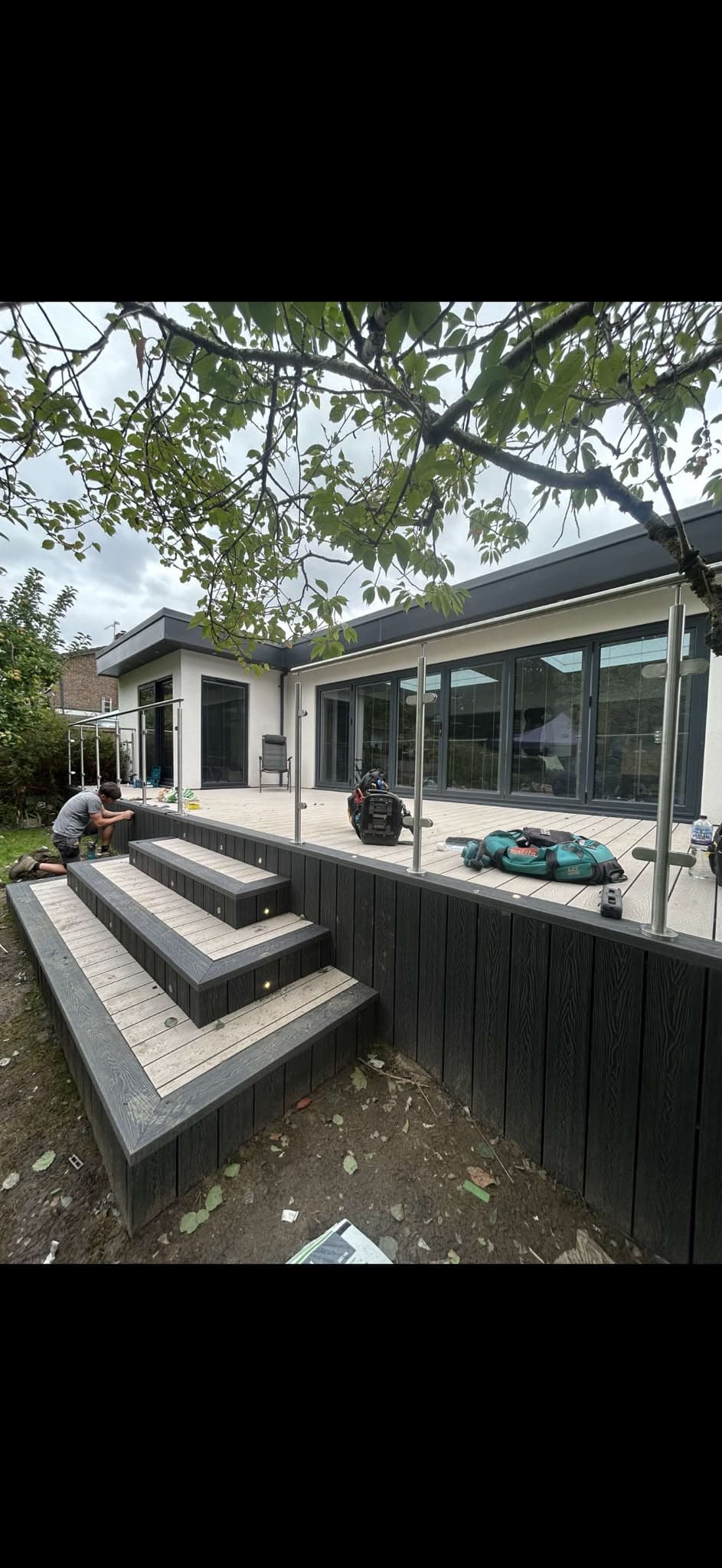 Low-voltage step lighting installed into a garden decking build
